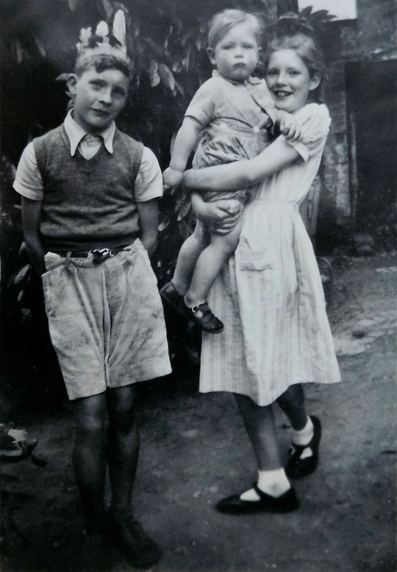 Graham, with Josephine holding [me], Philip Holland, about 1953.